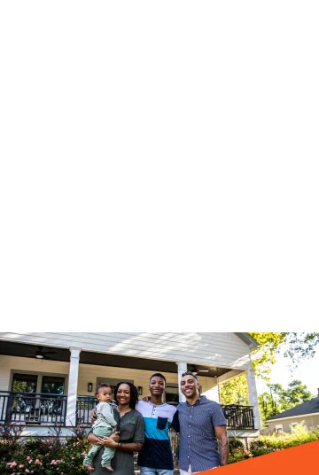 Family in front of their home.