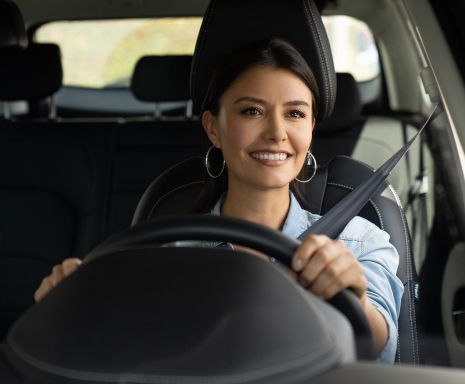 Woman smiling while driving