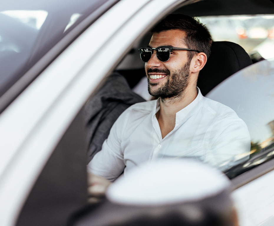 Man wearing glasses driving