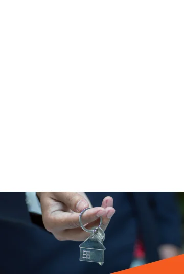 A person holding a house key.