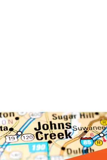 A lake with geese and blue, sunny skies by Perimeter Church: Cheap car insurance in Johns Creek, Georgia.