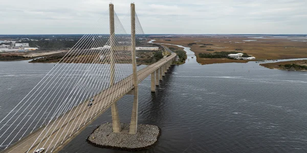 Old hoist motor with a beautiful view of a shipyard in the background in Brunswick, GA. Cheap car insurance in Georgia.